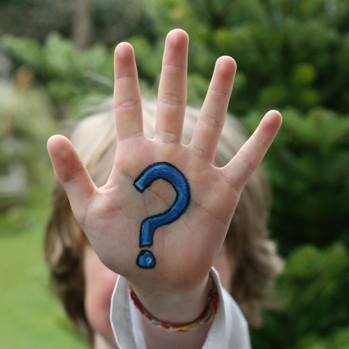 Question mark painted on hand