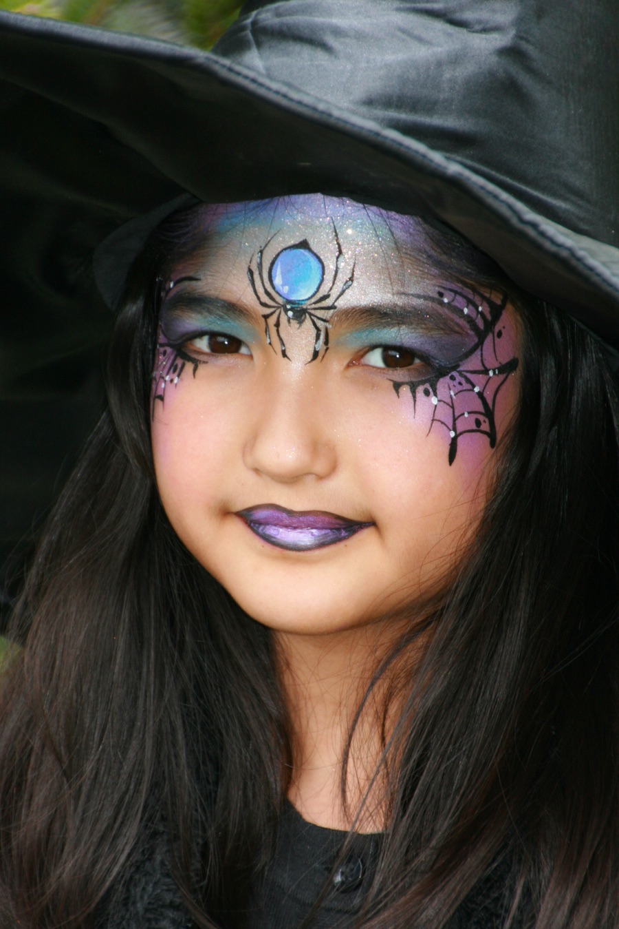 Witch face painting for Halloween