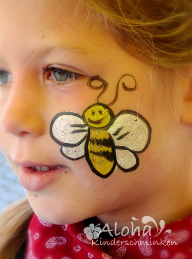 Bee face painting for children with a friendly expression