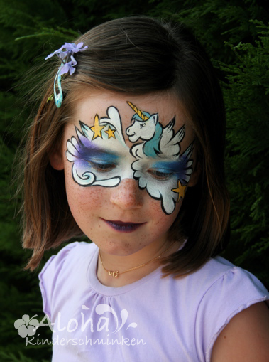 Unicorn face painting with glitter and fine details