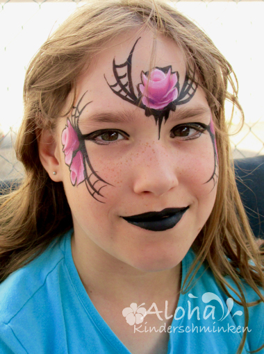 Halloween face art with spooky design and creative details