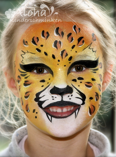 Leopard face paint design with animal pattern