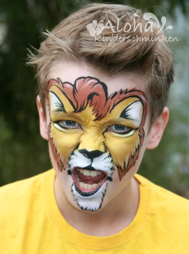 Lion face painting with a detailed mane for children