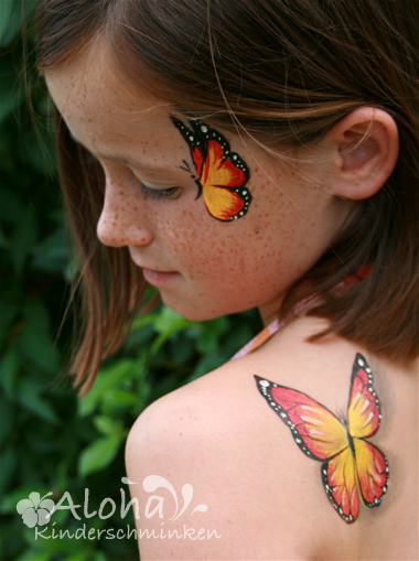 Butterfly face painting design with light, detailed patterns