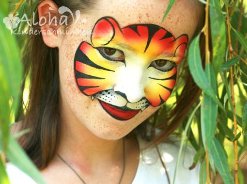 Tiger face painting with bold expression