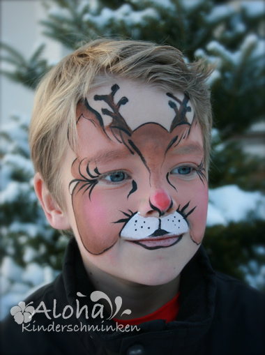 Christmas face paint design with festive winter details